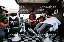 Sergio Perez (MEX) Racing Point Force India F1 Team visits the paddock barbers. 25.10.2018. Formula 1 World Championship, Rd 19, Mexican Grand Prix, Mexico City, Mexico, Preparation Day.