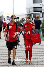 Sebastian Vettel (GER) Ferrari with Britta Roeske (AUT) Ferrari Press Officer. 28.09.2018. Formula 1 World Championship, Rd 16, Russian Grand Prix, Sochi Autodrom, Sochi, Russia, Practice Day.