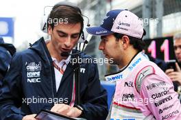Sergio Perez (MEX) Racing Point Force India F1 Team with Tim Wright (GBR) Racing Point Force India F1 Team Race Engineer on the grid. 30.09.2018. Formula 1 World Championship, Rd 16, Russian Grand Prix, Sochi Autodrom, Sochi, Russia, Race Day.