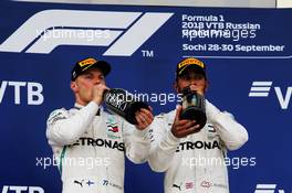 (L to R): second placed Valtteri Bottas (FIN) Mercedes AMG F1 on the podium with race winner and team mate Lewis Hamilton (GBR) Mercedes AMG F1. 30.09.2018. Formula 1 World Championship, Rd 16, Russian Grand Prix, Sochi Autodrom, Sochi, Russia, Race Day.