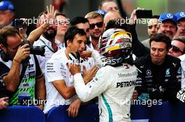 Race winner Lewis Hamilton (GBR) Mercedes AMG F1 celebrates with the team in parc ferme. 30.09.2018. Formula 1 World Championship, Rd 16, Russian Grand Prix, Sochi Autodrom, Sochi, Russia, Race Day.