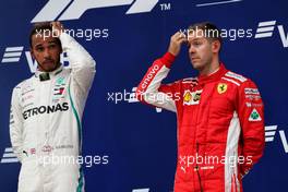 (L to R): Race winner Lewis Hamilton (GBR) Mercedes AMG F1 with third placed Sebastian Vettel (GER) Ferrari on the podium. 30.09.2018. Formula 1 World Championship, Rd 16, Russian Grand Prix, Sochi Autodrom, Sochi, Russia, Race Day.