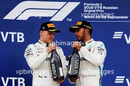 (L to R): second placed Valtteri Bottas (FIN) Mercedes AMG F1 on the podium with race winner and team mate Lewis Hamilton (GBR) Mercedes AMG F1. 30.09.2018. Formula 1 World Championship, Rd 16, Russian Grand Prix, Sochi Autodrom, Sochi, Russia, Race Day.