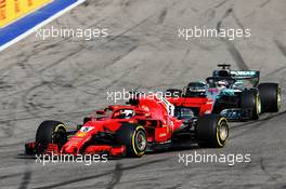 Sebastian Vettel (GER) Ferrari SF71H leads Lewis Hamilton (GBR) Mercedes AMG F1 W09. 30.09.2018. Formula 1 World Championship, Rd 16, Russian Grand Prix, Sochi Autodrom, Sochi, Russia, Race Day.