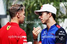 (L to R): Sebastian Vettel (GER) Ferrari with Pierre Gasly (FRA) Scuderia Toro Rosso. 27.09.2018. Formula 1 World Championship, Rd 16, Russian Grand Prix, Sochi Autodrom, Sochi, Russia, Preparation Day.