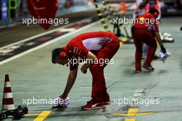 Ferrari clear up fluid left by Sebastian Vettel (GER) Ferrari SF71H. 14.09.2018. Formula 1 World Championship, Rd 15, Singapore Grand Prix, Marina Bay Street Circuit, Singapore, Practice Day.