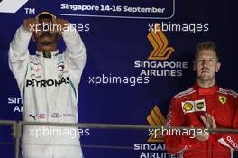 1st place Lewis Hamilton (GBR) Mercedes AMG F1 W09 and 3rd place Sebastian Vettel (GER) Ferrari SF71H. 16.09.2018. Formula 1 World Championship, Rd 15, Singapore Grand Prix, Marina Bay Street Circuit, Singapore, Race Day.