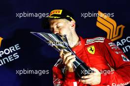 Sebastian Vettel (GER) Ferrari celebrates his third position on the podium. 16.09.2018. Formula 1 World Championship, Rd 15, Singapore Grand Prix, Marina Bay Street Circuit, Singapore, Race Day.