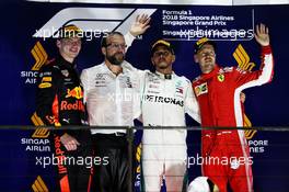 The podium (L to R): Max Verstappen (NLD) Red Bull Racing, second; Lewis Hamilton (GBR) Mercedes AMG F1, race winner; Sebastian Vettel (GER) Ferrari, third. 16.09.2018. Formula 1 World Championship, Rd 15, Singapore Grand Prix, Marina Bay Street Circuit, Singapore, Race Day.
