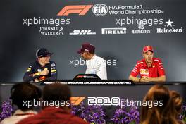 The post race FIA Press Conference (L to R): Max Verstappen (NLD) Red Bull Racing, second; Lewis Hamilton (GBR) Mercedes AMG F1, race winner; Sebastian Vettel (GER) Ferrari, third. 16.09.2018. Formula 1 World Championship, Rd 15, Singapore Grand Prix, Marina Bay Street Circuit, Singapore, Race Day.