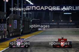 (L to R): Sergio Perez (MEX) Racing Point Force India F1 VJM11 and Sebastian Vettel (GER) Ferrari SF71H. 16.09.2018. Formula 1 World Championship, Rd 15, Singapore Grand Prix, Marina Bay Street Circuit, Singapore, Race Day.