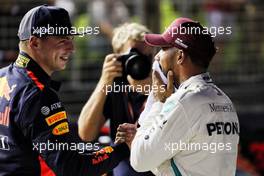 (L to R): second placed Max Verstappen (NLD) Red Bull Racing congratulates Lewis Hamilton (GBR) Mercedes AMG F1 on his pole position in qualifying parc ferme. 15.09.2018. Formula 1 World Championship, Rd 15, Singapore Grand Prix, Marina Bay Street Circuit, Singapore, Qualifying Day.