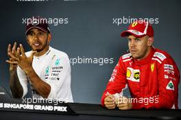 (L to R): Lewis Hamilton (GBR) Mercedes AMG F1 and Sebastian Vettel (GER) Ferrari in the post qualifying FIA Press Conference. 15.09.2018. Formula 1 World Championship, Rd 15, Singapore Grand Prix, Marina Bay Street Circuit, Singapore, Qualifying Day.