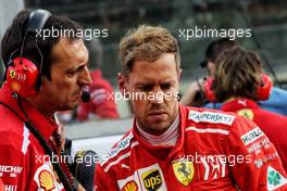 Sebastian Vettel (GER) Ferrari on the grid. 25.11.2018. Formula 1 World Championship, Rd 21, Abu Dhabi Grand Prix, Yas Marina Circuit, Abu Dhabi, Race Day.