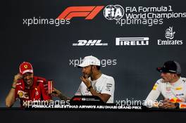 The post race FIA Press Conference (L to R): Sebastian Vettel (GER) Ferrari, second; Lewis Hamilton (GBR) Mercedes AMG F1, race winner; Max Verstappen (NLD) Red Bull Racing, third. 25.11.2018. Formula 1 World Championship, Rd 21, Abu Dhabi Grand Prix, Yas Marina Circuit, Abu Dhabi, Race Day.