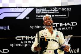 Race winner Lewis Hamilton (GBR) Mercedes AMG F1 celebrates on the podium. 25.11.2018. Formula 1 World Championship, Rd 21, Abu Dhabi Grand Prix, Yas Marina Circuit, Abu Dhabi, Race Day.