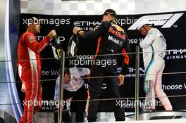 The podium (L to R): second placed Sebastian Vettel (GER) Ferrari celebrates with third placed Max Verstappen (NLD) Red Bull Racing and race winner Lewis Hamilton (GBR) Mercedes AMG F1. 25.11.2018. Formula 1 World Championship, Rd 21, Abu Dhabi Grand Prix, Yas Marina Circuit, Abu Dhabi, Race Day.