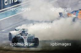 Race winner Lewis Hamilton (GBR) Mercedes AMG F1 W09 and Fernando Alonso (ESP) McLaren MCL33 perform doughnuts at the end of the race. 25.11.2018. Formula 1 World Championship, Rd 21, Abu Dhabi Grand Prix, Yas Marina Circuit, Abu Dhabi, Race Day.