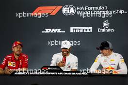 The post race FIA Press Conference (L to R): Sebastian Vettel (GER) Ferrari, second; Lewis Hamilton (GBR) Mercedes AMG F1, race winner; Max Verstappen (NLD) Red Bull Racing, third. 25.11.2018. Formula 1 World Championship, Rd 21, Abu Dhabi Grand Prix, Yas Marina Circuit, Abu Dhabi, Race Day.