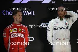 Sebastian Vettel (GER) Ferrari SF71H and Lewis Hamilton (GBR) Mercedes AMG F1 W09. 25.11.2018. Formula 1 World Championship, Rd 21, Abu Dhabi Grand Prix, Yas Marina Circuit, Abu Dhabi, Race Day.