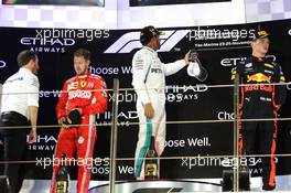 The podium (L to R): Sebastian Vettel (GER) Ferrari, second; Lewis Hamilton (GBR) Mercedes AMG F1, race winner; Max Verstappen (NLD) Red Bull Racing, third. 25.11.2018. Formula 1 World Championship, Rd 21, Abu Dhabi Grand Prix, Yas Marina Circuit, Abu Dhabi, Race Day.