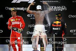 1st place Lewis Hamilton (GBR) Mercedes AMG F1 W09, 2nd place Sebastian Vettel (GER) Ferrari SF71H and 3rd place Max Verstappen (NLD) Red Bull Racing RB14. 25.11.2018. Formula 1 World Championship, Rd 21, Abu Dhabi Grand Prix, Yas Marina Circuit, Abu Dhabi, Race Day.