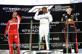 The podium (L to R): Sebastian Vettel (GER) Ferrari, second; Lewis Hamilton (GBR) Mercedes AMG F1, race winner; Max Verstappen (NLD) Red Bull Racing, third. 25.11.2018. Formula 1 World Championship, Rd 21, Abu Dhabi Grand Prix, Yas Marina Circuit, Abu Dhabi, Race Day.