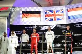 The podium (L to R): Sebastian Vettel (GER) Ferrari, second; Lewis Hamilton (GBR) Mercedes AMG F1, race winner; Max Verstappen (NLD) Red Bull Racing, third. 25.11.2018. Formula 1 World Championship, Rd 21, Abu Dhabi Grand Prix, Yas Marina Circuit, Abu Dhabi, Race Day.