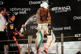 Race winner Lewis Hamilton (GBR) Mercedes AMG F1 celebrates on the podium with Max Verstappen (NLD) Red Bull Racing. 25.11.2018. Formula 1 World Championship, Rd 21, Abu Dhabi Grand Prix, Yas Marina Circuit, Abu Dhabi, Race Day.