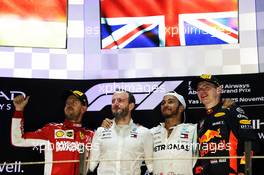 The podium (L to R): Sebastian Vettel (GER) Ferrari, second; Bradley Lord (GBR) Mercedes AMG F1 Communications Manager; Lewis Hamilton (GBR) Mercedes AMG F1, race winner; Max Verstappen (NLD) Red Bull Racing, third. 25.11.2018. Formula 1 World Championship, Rd 21, Abu Dhabi Grand Prix, Yas Marina Circuit, Abu Dhabi, Race Day.