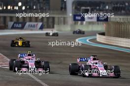 (L to R): Esteban Ocon (FRA) Racing Point Force India F1 VJM11 and Sergio Perez (MEX) Racing Point Force India F1 VJM11. 25.11.2018. Formula 1 World Championship, Rd 21, Abu Dhabi Grand Prix, Yas Marina Circuit, Abu Dhabi, Race Day.
