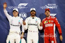 Qualifying top three in parc ferme (L to R): Valtteri Bottas (FIN) Mercedes AMG F1, second; Lewis Hamilton (GBR) Mercedes AMG F1, pole position; Sebastian Vettel (GER) Ferrari, third. 24.11.2018. Formula 1 World Championship, Rd 21, Abu Dhabi Grand Prix, Yas Marina Circuit, Abu Dhabi, Qualifying Day.