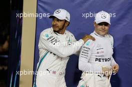 (L to R): Lewis Hamilton (GBR) Mercedes AMG F1 with team mate Valtteri Bottas (FIN) Mercedes AMG F1 in qualifying parc ferme. 24.11.2018. Formula 1 World Championship, Rd 21, Abu Dhabi Grand Prix, Yas Marina Circuit, Abu Dhabi, Qualifying Day.