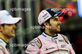 Sergio Perez (MEX) Racing Point Force India F1 Team and Esteban Ocon (FRA) Racing Point Force India F1 Team at a team photograph. 24.11.2018. Formula 1 World Championship, Rd 21, Abu Dhabi Grand Prix, Yas Marina Circuit, Abu Dhabi, Qualifying Day.