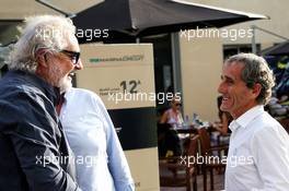 (L to R): Flavio Briatore (ITA) with Alain Prost (FRA) Renault Sport F1 Team Special Advisor. 24.11.2018. Formula 1 World Championship, Rd 21, Abu Dhabi Grand Prix, Yas Marina Circuit, Abu Dhabi, Qualifying Day.