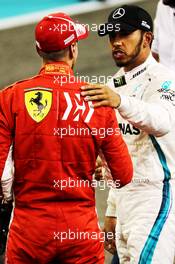 Lewis Hamilton (GBR) Mercedes AMG F1 celebrates his pole position in qualifying parc ferme with third placed Sebastian Vettel (GER) Ferrari. 24.11.2018. Formula 1 World Championship, Rd 21, Abu Dhabi Grand Prix, Yas Marina Circuit, Abu Dhabi, Qualifying Day.