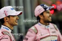 Esteban Ocon (FRA) Racing Point Force India F1 Team and Sergio Perez (MEX) Racing Point Force India F1 Team at a team photograph. 24.11.2018. Formula 1 World Championship, Rd 21, Abu Dhabi Grand Prix, Yas Marina Circuit, Abu Dhabi, Qualifying Day.