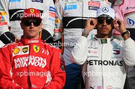 Kimi Raikkonen (FIN) Scuderia Ferrari and Lewis Hamilton (GBR) Mercedes AMG F1   25.11.2018. Formula 1 World Championship, Rd 21, Abu Dhabi Grand Prix, Yas Marina Circuit, Abu Dhabi, Race Day.