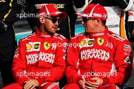 (L to R): Sebastian Vettel (GER) Ferrari with Kimi Raikkonen (FIN) Ferrari at the end of season photograph. 25.11.2018. Formula 1 World Championship, Rd 21, Abu Dhabi Grand Prix, Yas Marina Circuit, Abu Dhabi, Race Day.