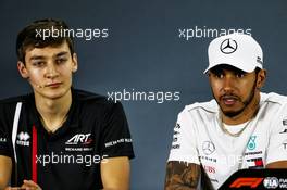 (L to R): George Russell (GBR) Art Grand Prix F2 Driver / Mercedes AMG F1 Reserve Driver / Williams and Lewis Hamilton (GBR) Mercedes AMG F1 in the FIA Press Conference. 22.11.2018. Formula 1 World Championship, Rd 21, Abu Dhabi Grand Prix, Yas Marina Circuit, Abu Dhabi, Preparation Day.