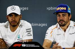 (L to R): Lewis Hamilton (GBR) Mercedes AMG F1 and Fernando Alonso (ESP) McLaren in the FIA Press Conference. 22.11.2018. Formula 1 World Championship, Rd 21, Abu Dhabi Grand Prix, Yas Marina Circuit, Abu Dhabi, Preparation Day.