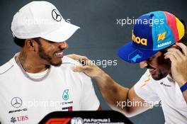 (L to R): Lewis Hamilton (GBR) Mercedes AMG F1 with Fernando Alonso (ESP) McLaren in the FIA Press Conference. 22.11.2018. Formula 1 World Championship, Rd 21, Abu Dhabi Grand Prix, Yas Marina Circuit, Abu Dhabi, Preparation Day.