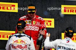 Race winner Kimi Raikkonen (FIN) Ferrari celebrates on the podium with Max Verstappen (NLD) Red Bull Racing (Left) and Lewis Hamilton (GBR) Mercedes AMG F1 (Right). 21.10.2018. Formula 1 World Championship, Rd 18, United States Grand Prix, Austin, Texas, USA, Race Day.