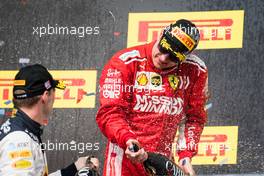 Race winner Kimi Raikkonen (FIN) Ferrari celebrates on the podium with second placed Max Verstappen (NLD) Red Bull Racing. 21.10.2018. Formula 1 World Championship, Rd 18, United States Grand Prix, Austin, Texas, USA, Race Day.