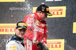 Race winner Kimi Raikkonen (FIN) Ferrari celebrates on the podium with second placed Max Verstappen (NLD) Red Bull Racing. 21.10.2018. Formula 1 World Championship, Rd 18, United States Grand Prix, Austin, Texas, USA, Race Day.