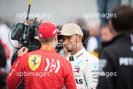 (L to R): Sebastian Vettel (GER) Ferrari with pole sitter Lewis Hamilton (GBR) Mercedes AMG F1 in qualifying parc ferme. 20.10.2018. Formula 1 World Championship, Rd 18, United States Grand Prix, Austin, Texas, USA, Qualifying Day.