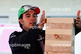Sergio Perez (MEX) Racing Point Force India F1 Team plays giant Jenga. 18.10.2018. Formula 1 World Championship, Rd 18, United States Grand Prix, Austin, Texas, USA, Preparation Day.