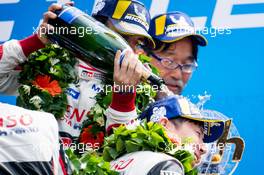 (L to R): Race winner Fernando Alonso (ESP) Toyota Gazoo Racing celebrates on the podium with second placed Kamui Kobayashi (JPN) Toyota Gazoo Racing. 16-17.06.2018. FIA World Endurance Championship, Le Mans 24 Hours, Race, Le Mans, France.