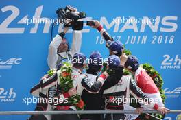 Race winners Sebastien Buemi (SUI) / Kazuki Nakajima (JPN) / Fernando Alonso (ESP) #08 Toyota Gazoo Racing and second placed Mike Conway (GBR) / Kamui Kobayashi (JPN) / Jose Maria Lopez (ARG) #07 Toyota Gazoo Racing, celebrate on the podium. 16-17.06.2018. FIA World Endurance Championship, Le Mans 24 Hours, Race, Le Mans, France.