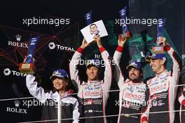 Toyota Gazoo Racing celebrate a 1-2 finish on the podium (L to R): Shigeki Tomoyama (JPN) President Gazoo Racing Company; Kazuki Nakajima (JPN); Fernando Alonso (ESP); Sebastien Buemi (SUI), second. 14.10.2018. FIA World Endurance Championship, Round 4, Six Hours of Fuji, Fuji, Japan, Sunday.